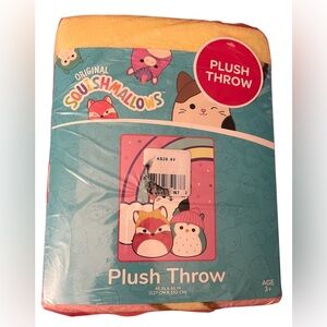 Squishmallows NWT plush throw with the rainbow background in size 46” by 60”
